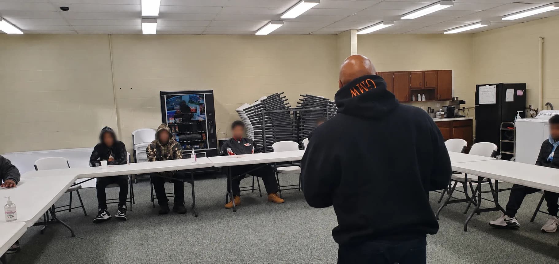 During a Legacy Builders event, TAM facilitator talks to young men about decision making and creating positive life outcomes.